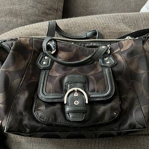 Coach fabric satchel with leather trim and leather wristlet.